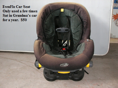 EvenFlo Car Seat
   Only used a few times
   Sat in Grandma's car
   for a year.  $50